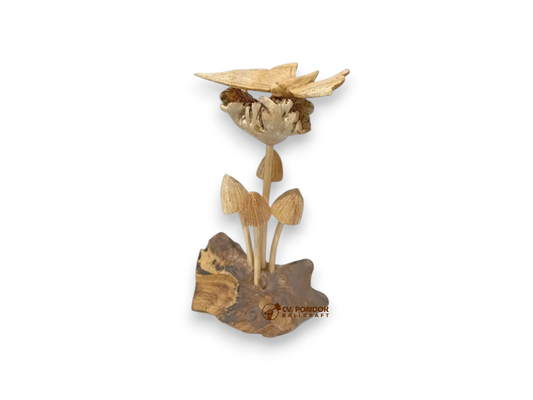 Hand-carved wooden butterfly resting on a wildflower above four mushrooms and a natural rootwood base