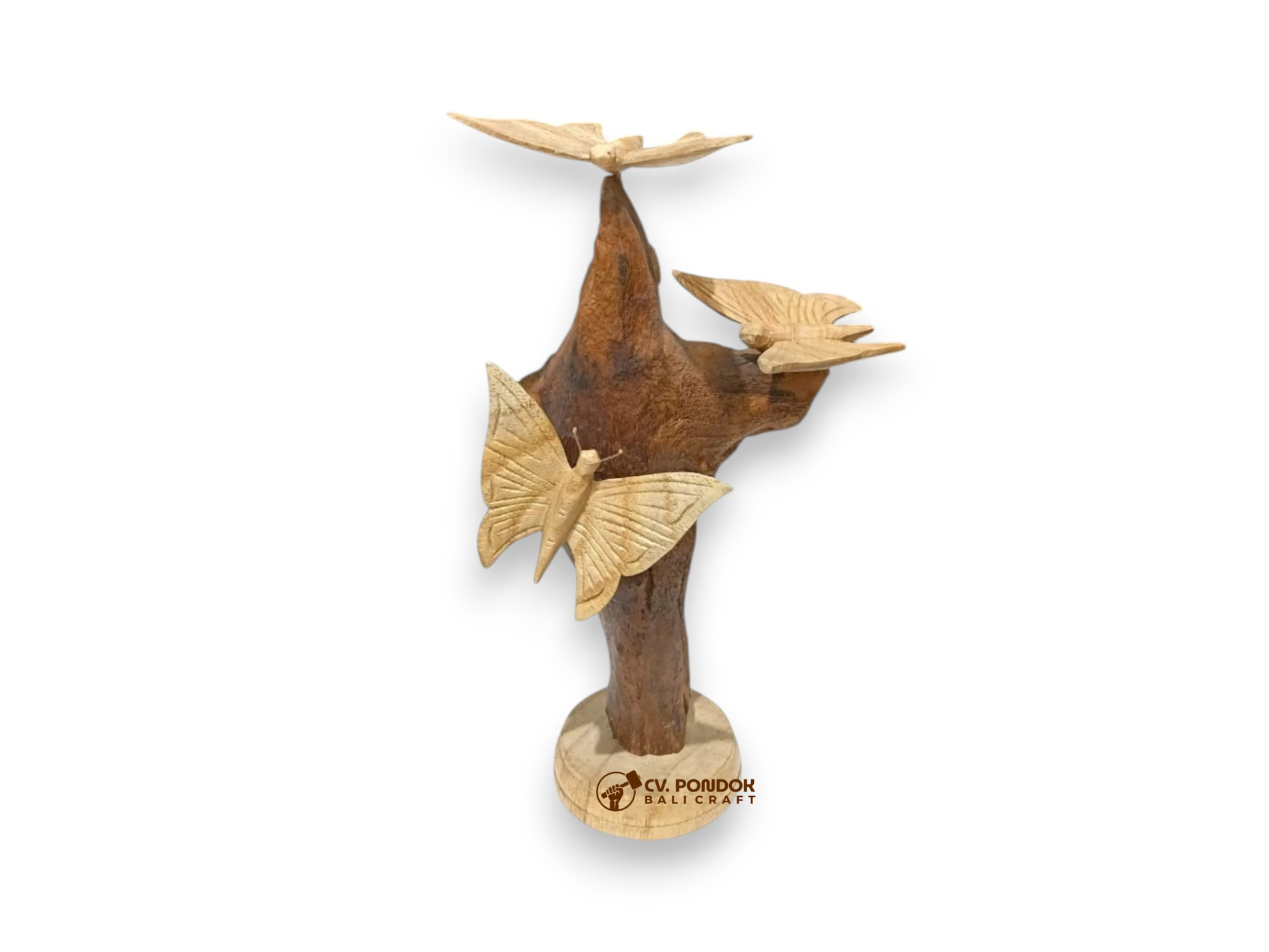 Three hand-carved wooden butterflies arranged on a tall natural rootwood tabletop sculpture
