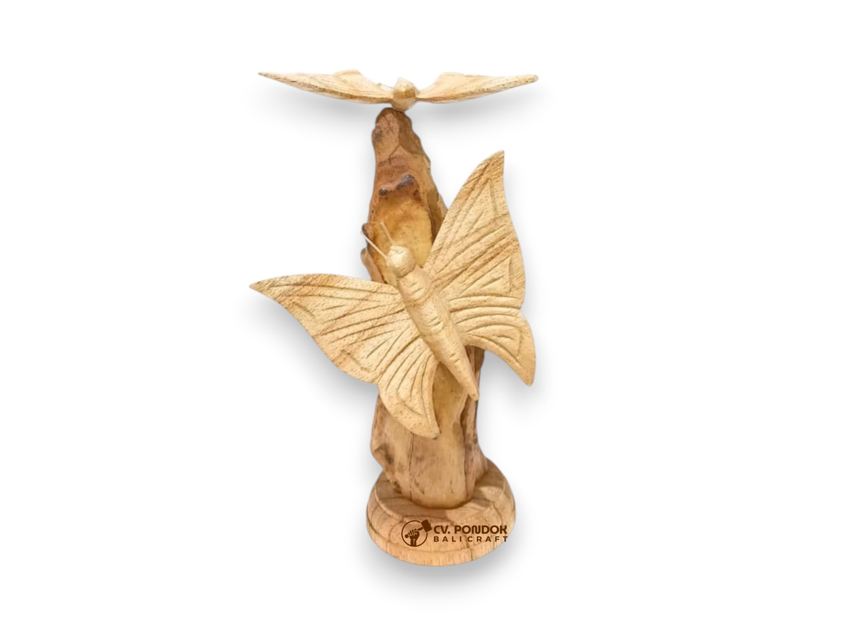 Two hand-carved wooden butterflies with detailed wings displayed on a natural rootwood trunk