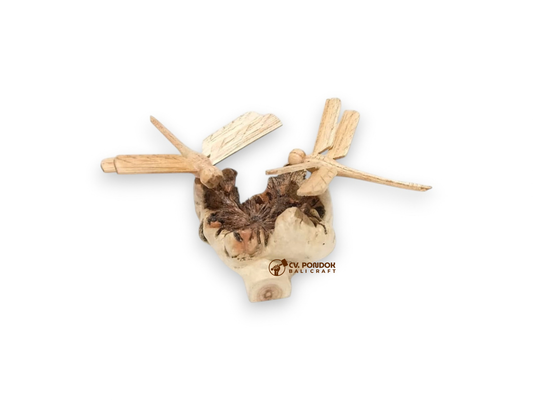 Two miniature hand-carved wooden dragonflies resting on a naturally shaped wooden base