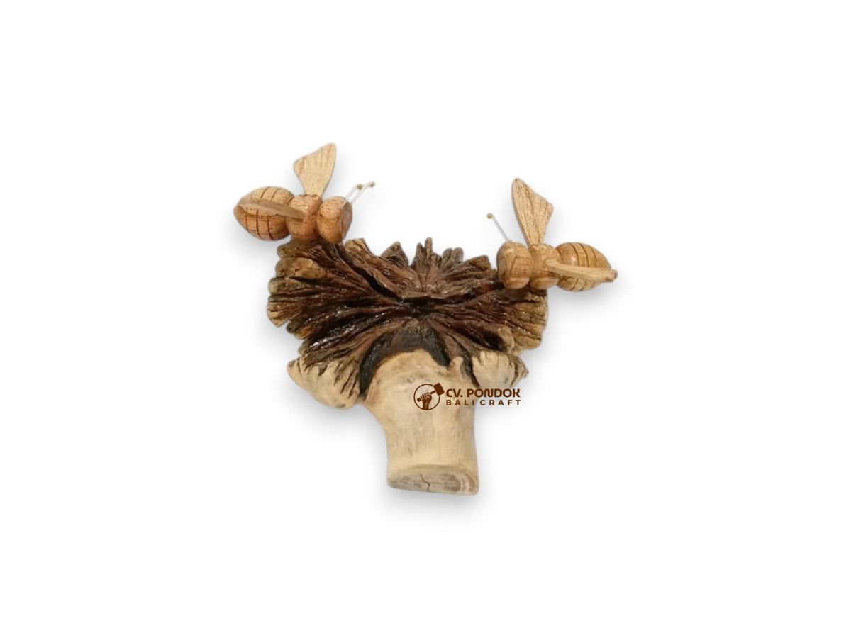 Two hand-carved wooden bees resting on a layered bracket mushroom sculpture