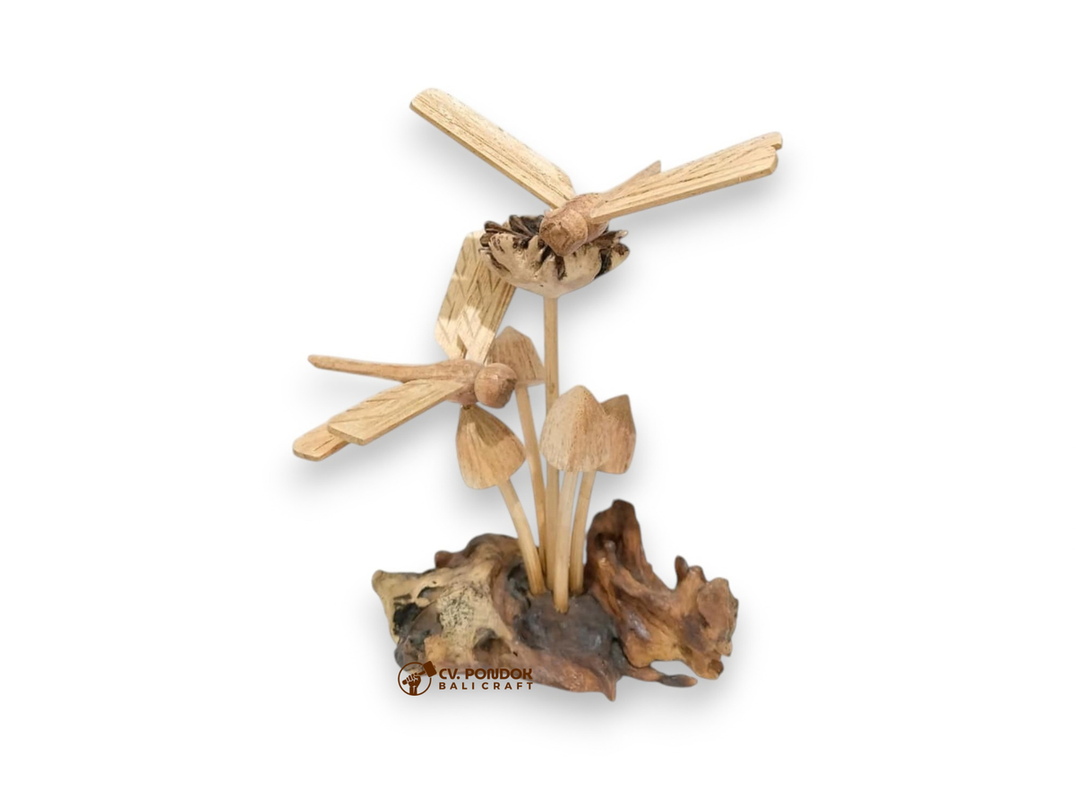 Two hand-carved wooden dragonflies flying above a mushroom cluster on a naturally shaped wood base