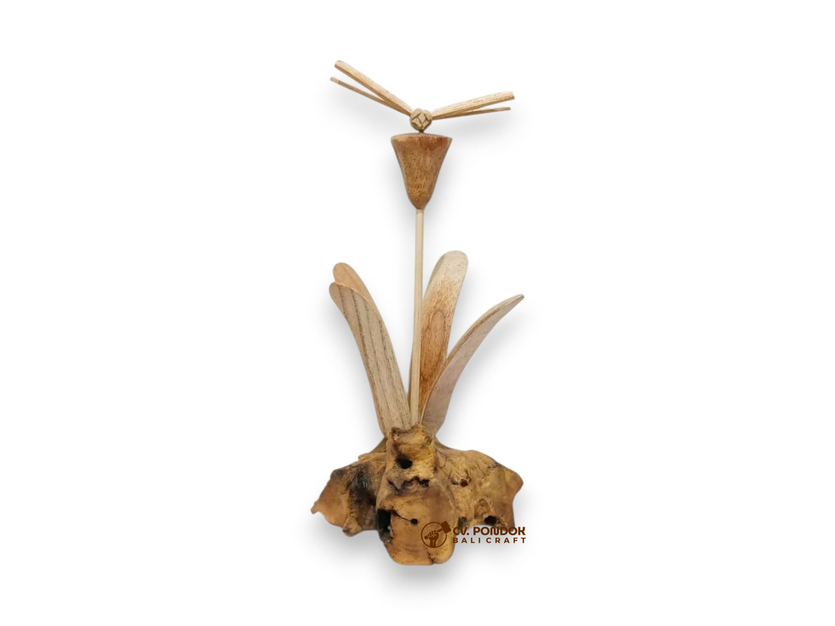Hand-carved wooden dragonfly hovering above a tall flower and leaves on a naturally shaped wood base