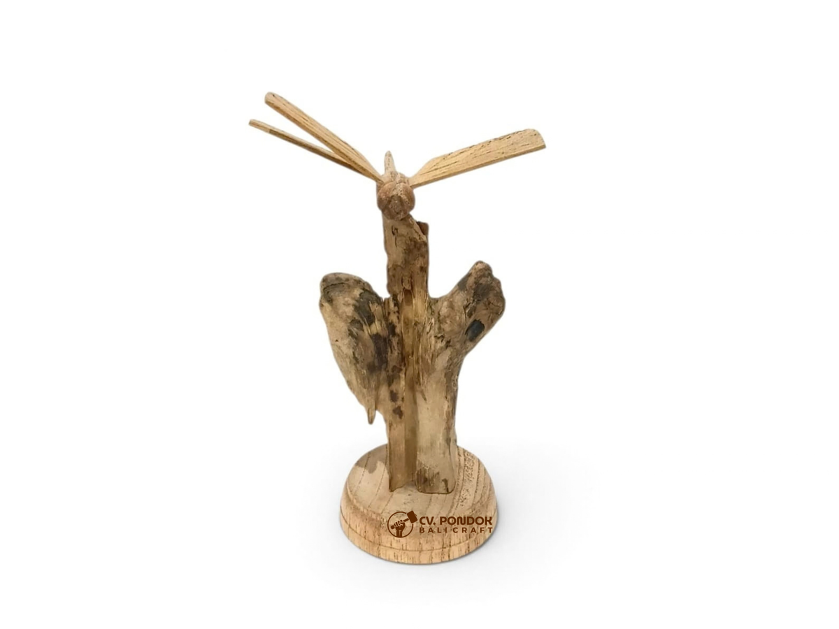 Hand-carved wooden dragonfly with four extended wings on a natural wood trunk and round base, minimum size 14 by 9 cm