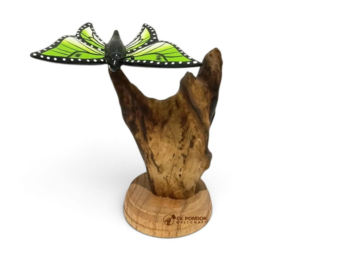 Hand-painted green, black, and white wooden butterfly with open wings on a natural wood stand, minimum 10 cm high and 10 cm wide