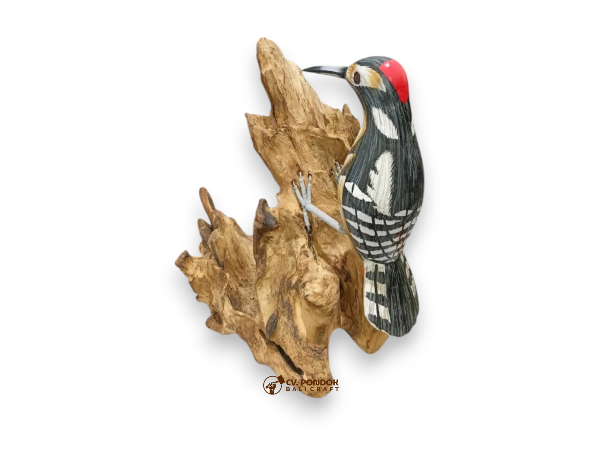 Hand-painted black-and-white spotted wooden woodpecker with a red crown clinging to natural rootwood