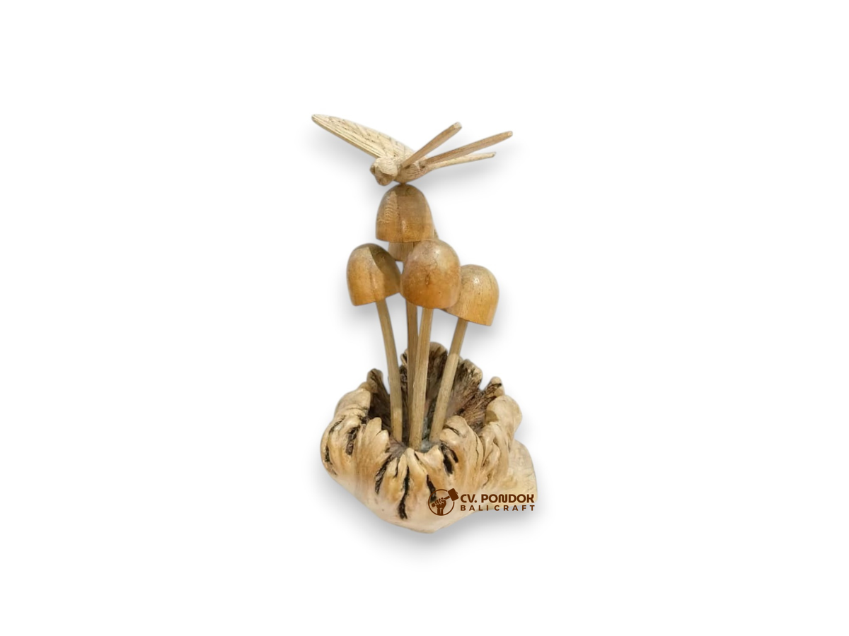 Hand-carved wooden dragonfly hovering above five mushrooms on a natural rootwood base