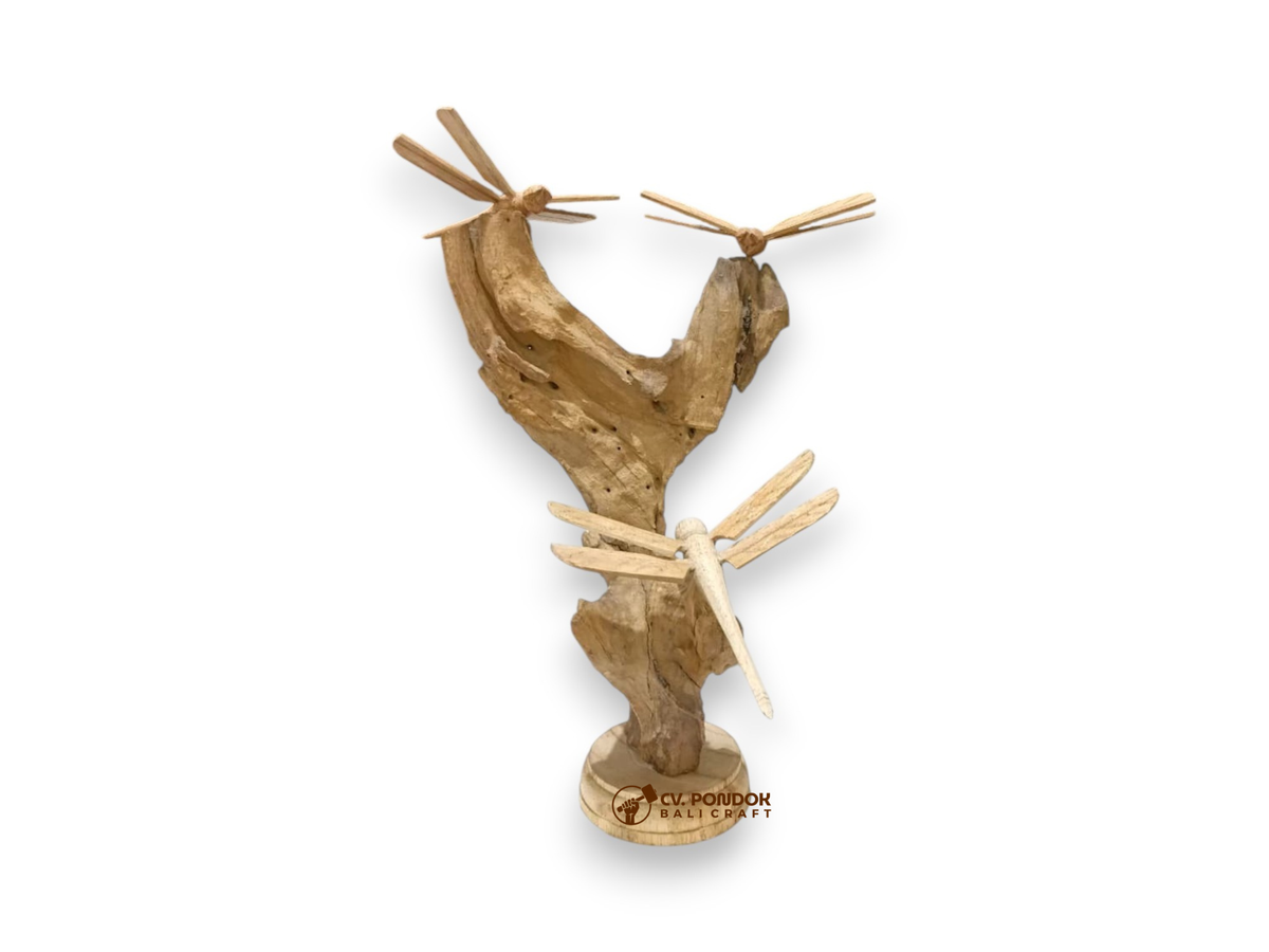 Three hand-carved wooden dragonflies resting on a tall natural rootwood tabletop sculpture